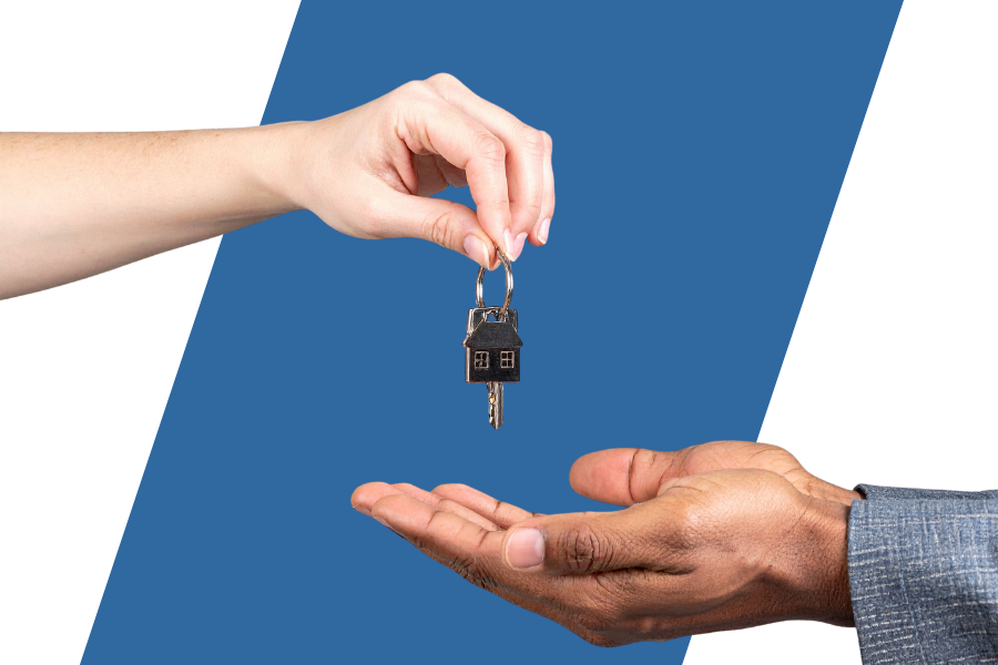 A person giving a house keys to another person 